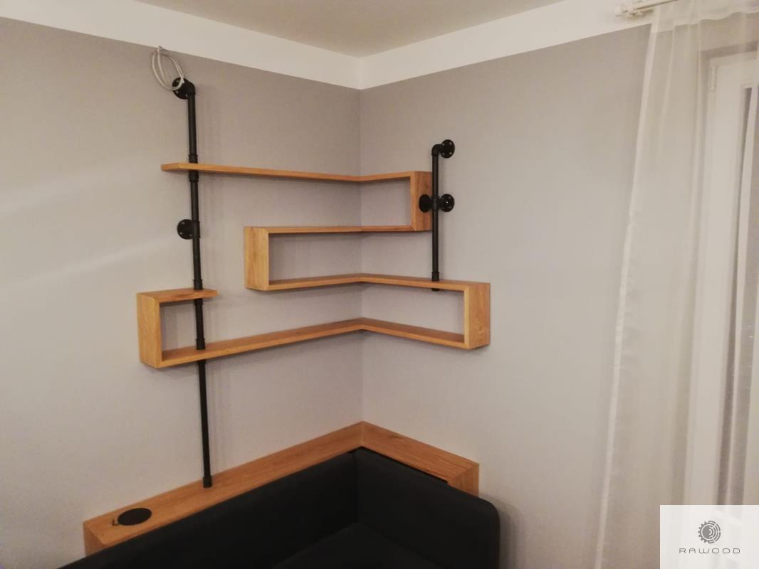Shelves of oak wood and steel in industrial style to living room